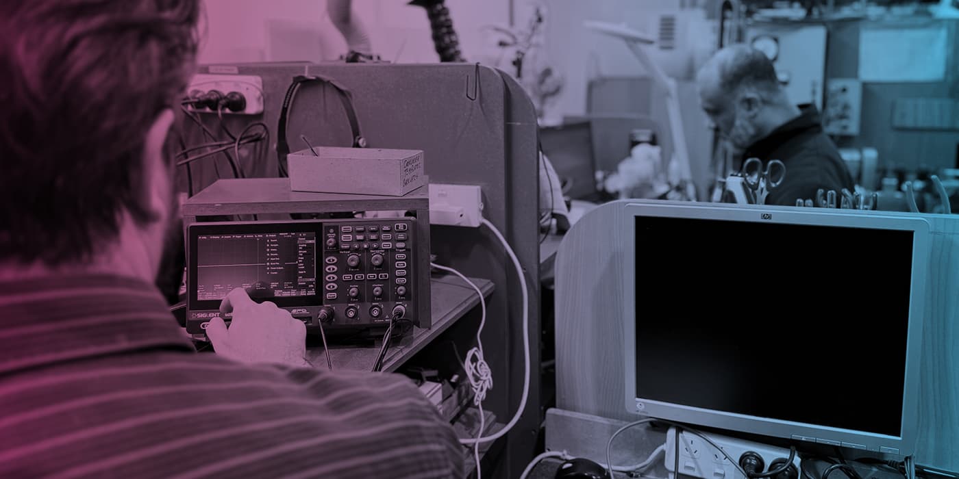 Technician using diagnostic test equipment in the Precision Electronics workshop
